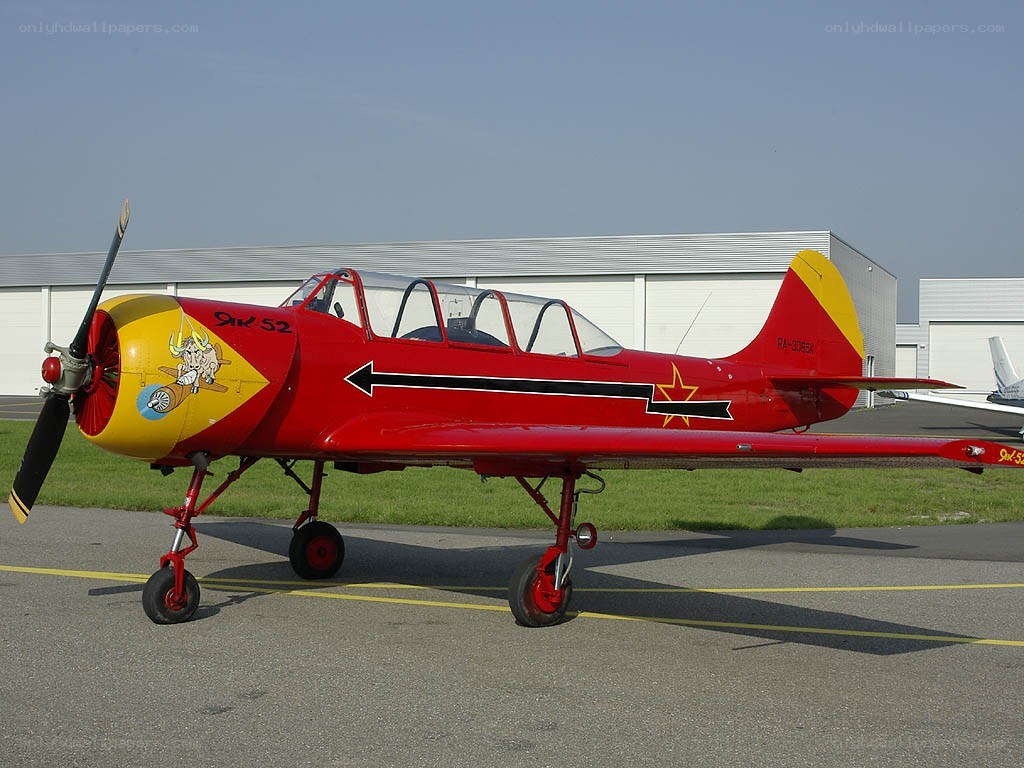 Red and yellow training aircraft