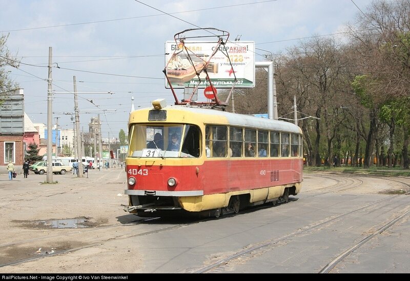 Red and yellow tram on city street