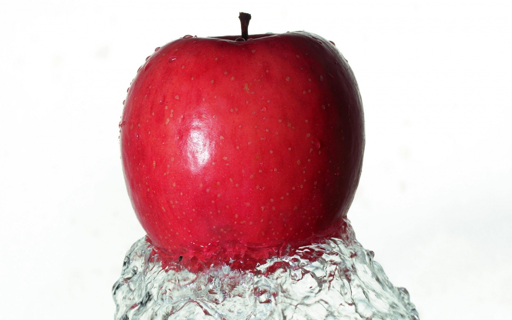 red apple in water splash