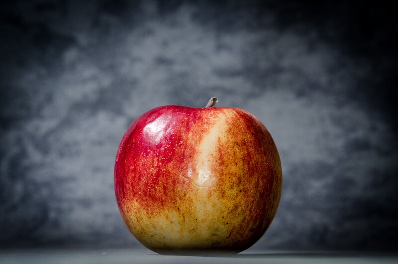 red apple on dark background