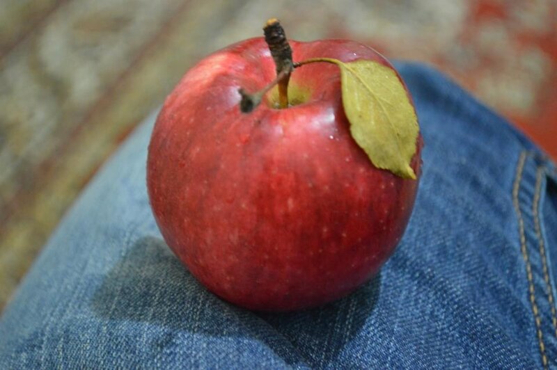 red apple on denim