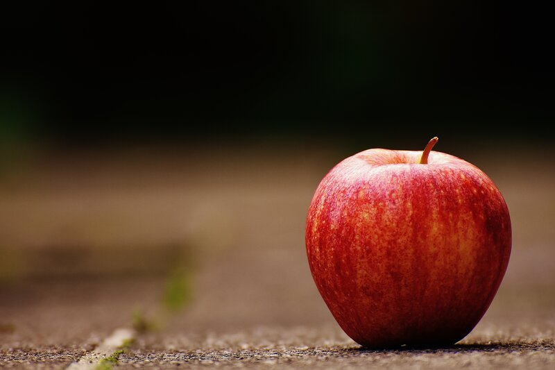 Red apple on ground