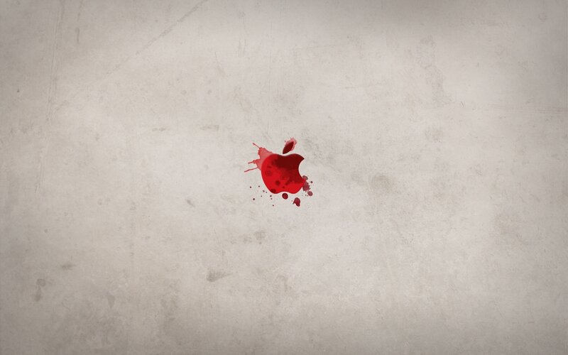 Red apple splatter on concrete