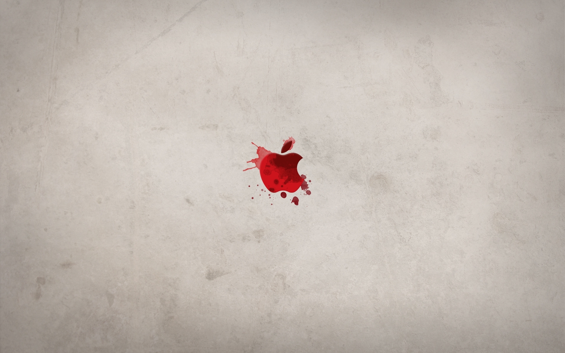 Red apple splatter on concrete