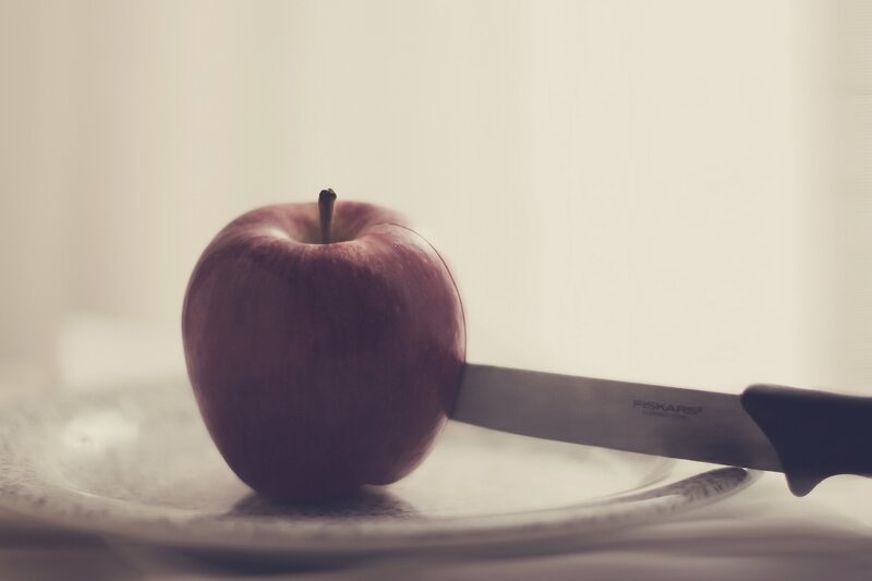 Red Apple with Knife