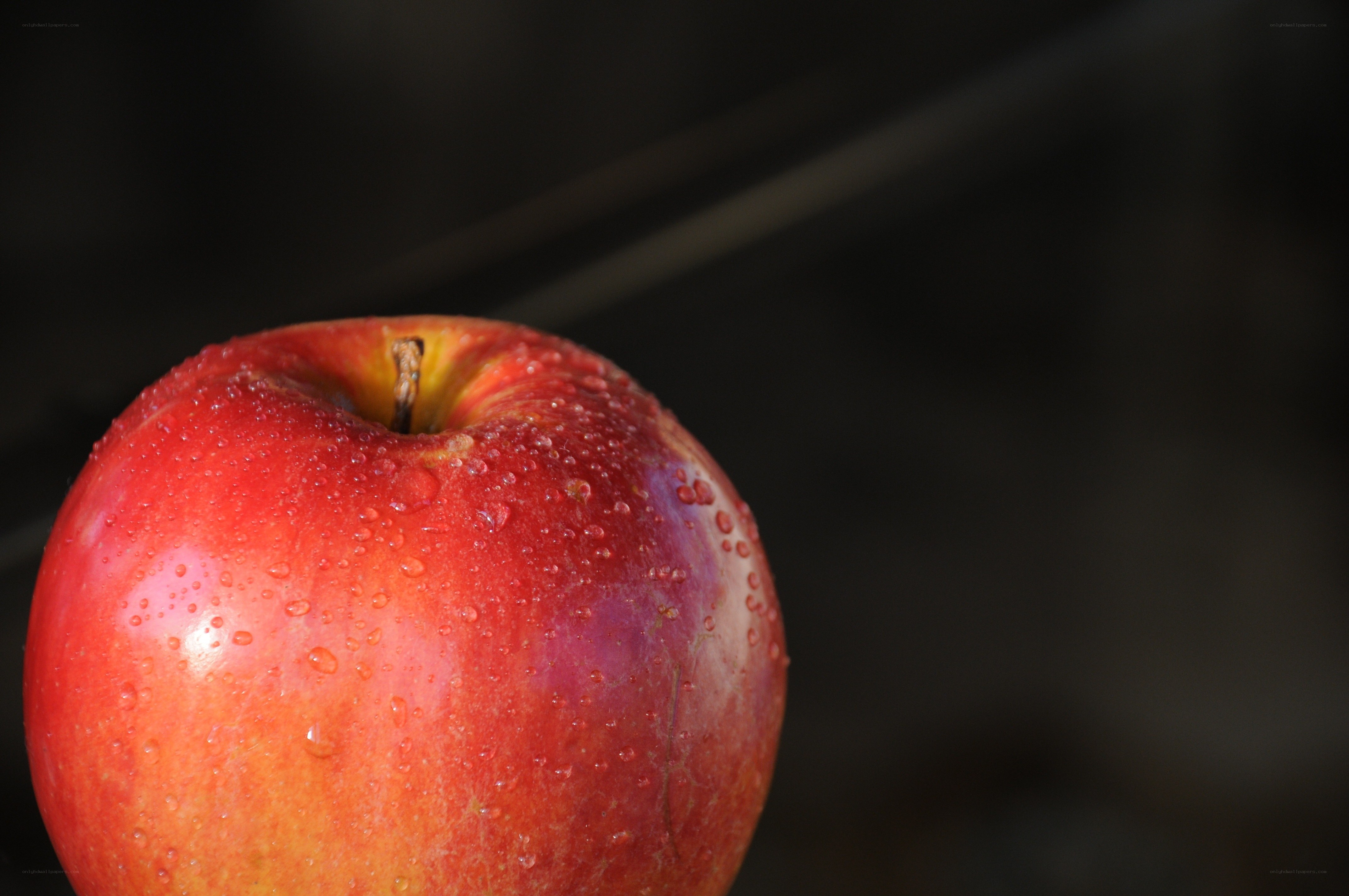 red apple with water droplets