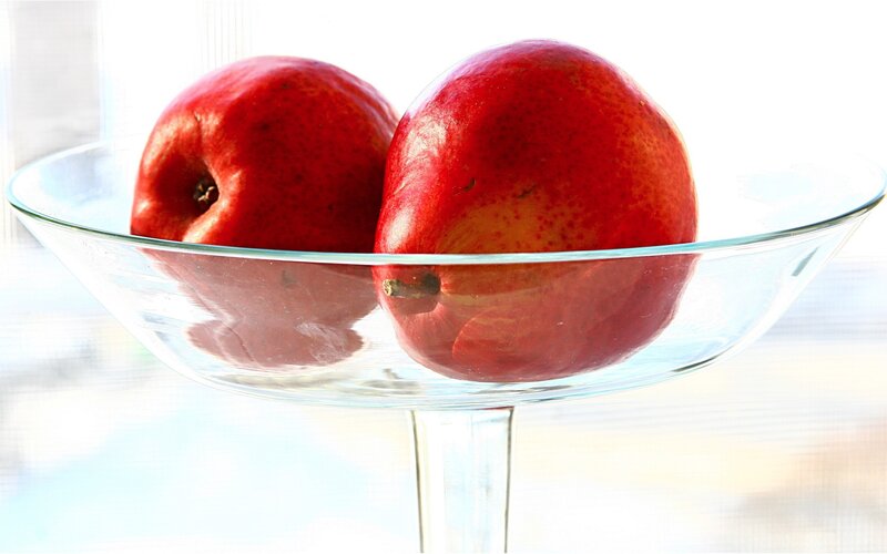 Red apples in glass bowl