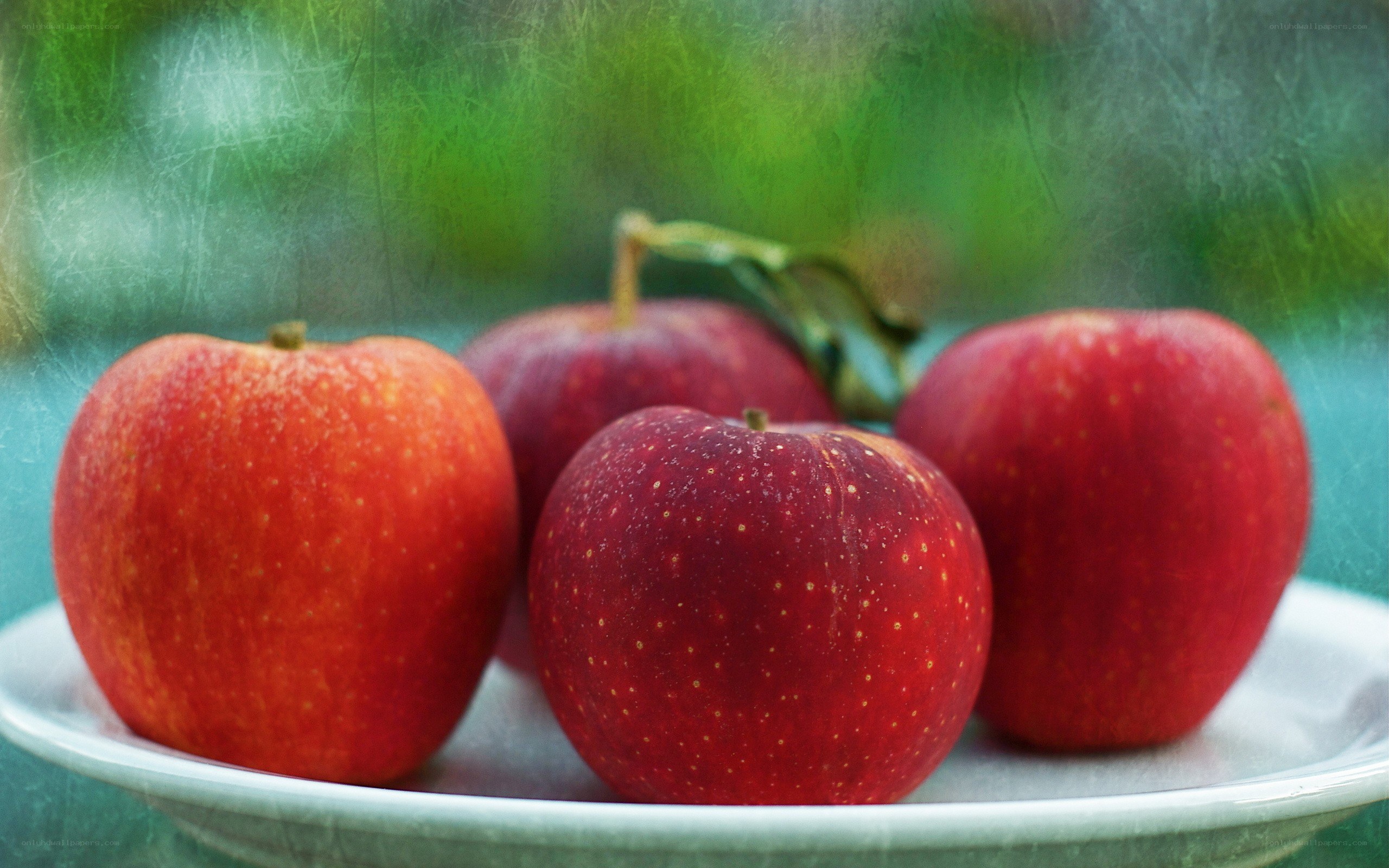 Red apples on a plate