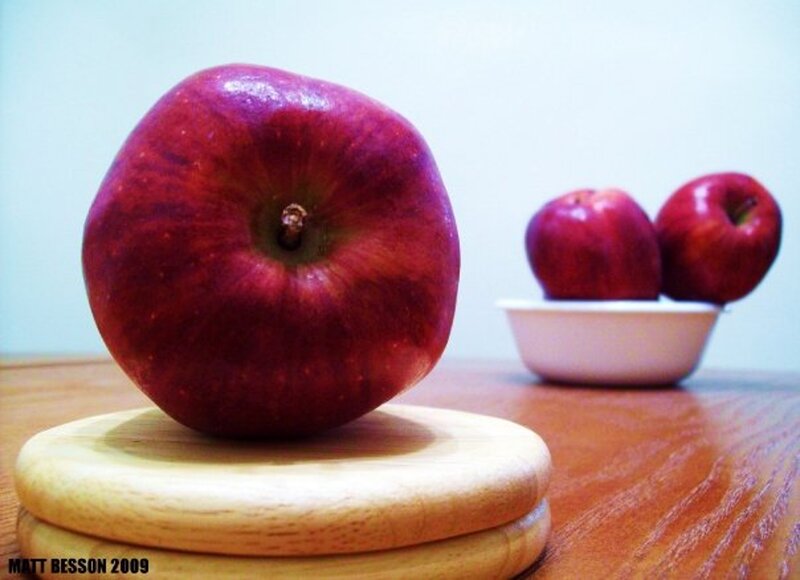 Red apples on a wooden table