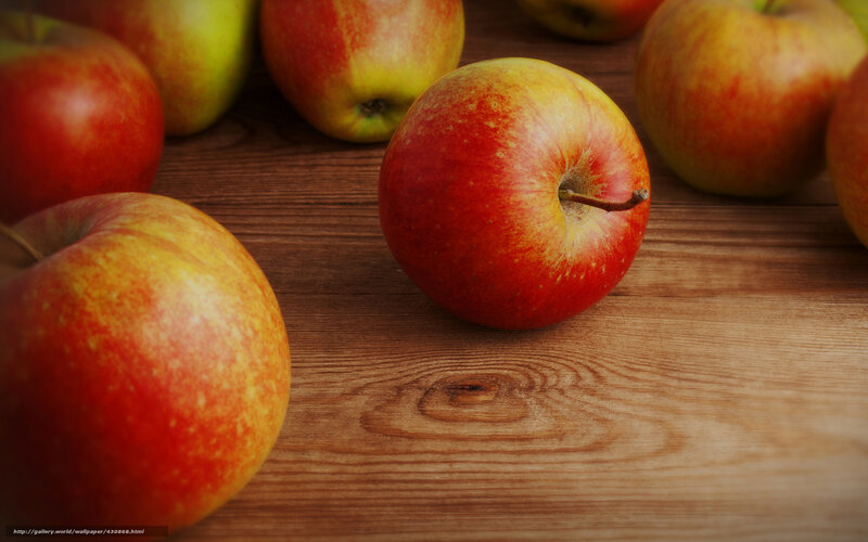 Red apples on wooden table