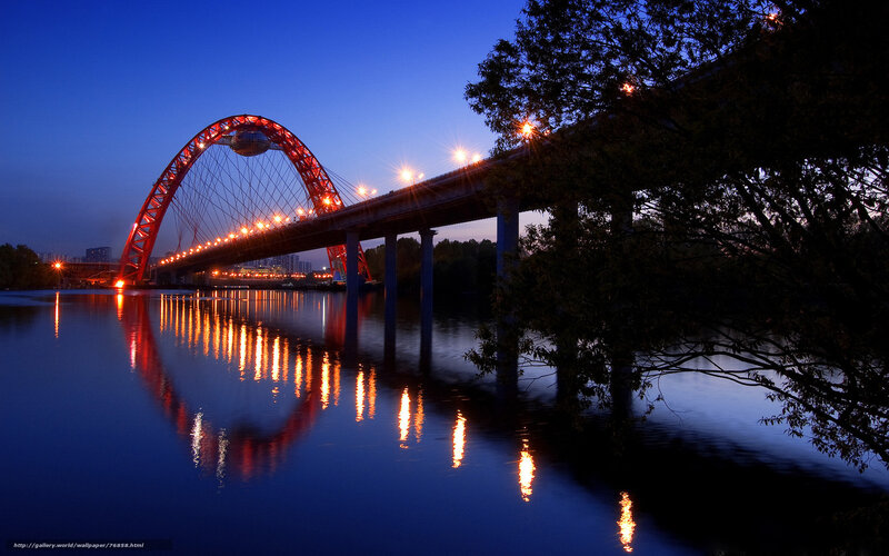Red arch bridge at dusk