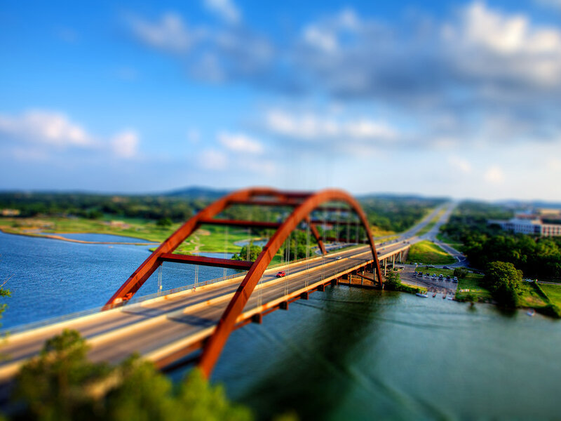 Red Arch Bridge over River — Blue