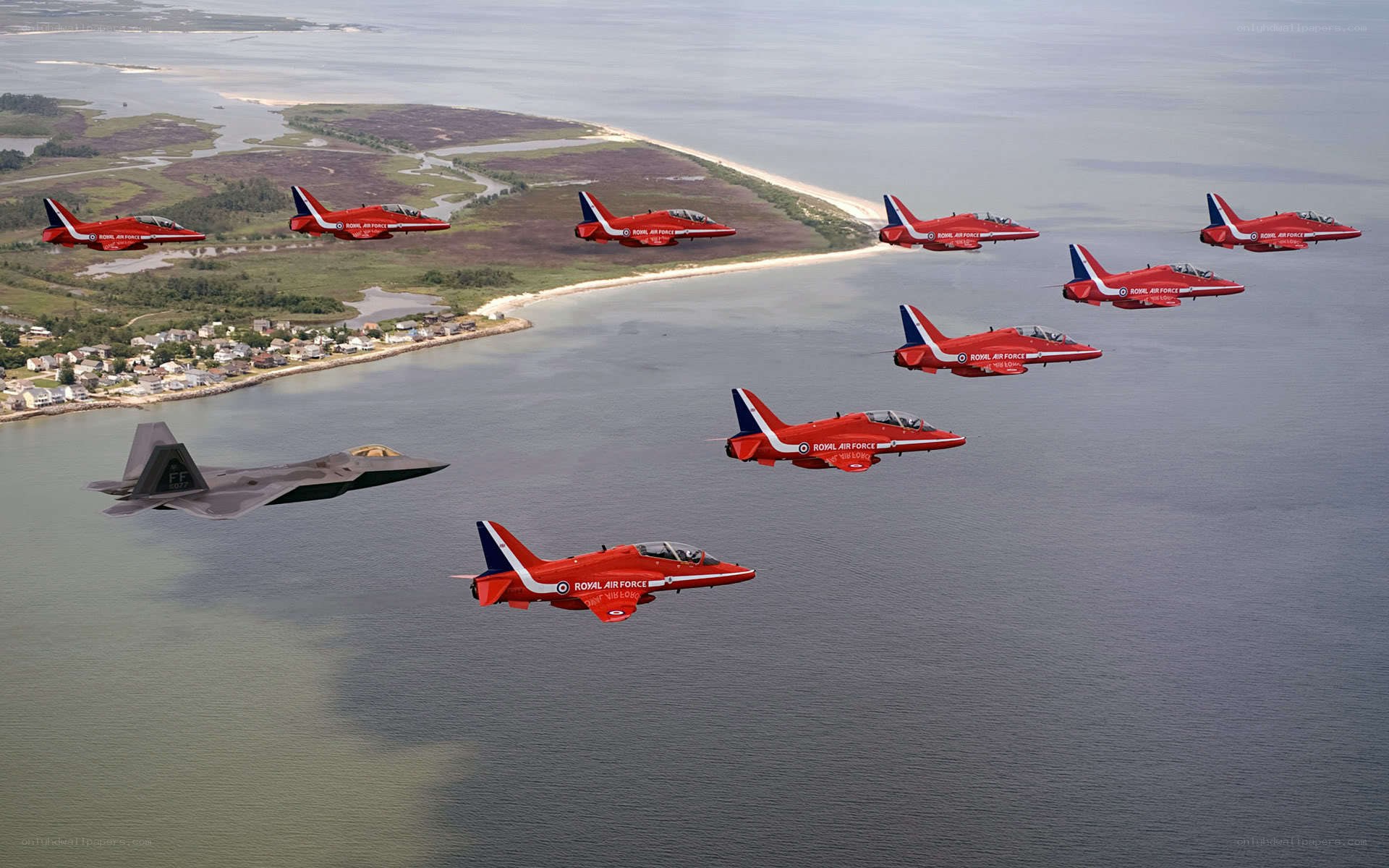 Red Arrows and F-22 over water