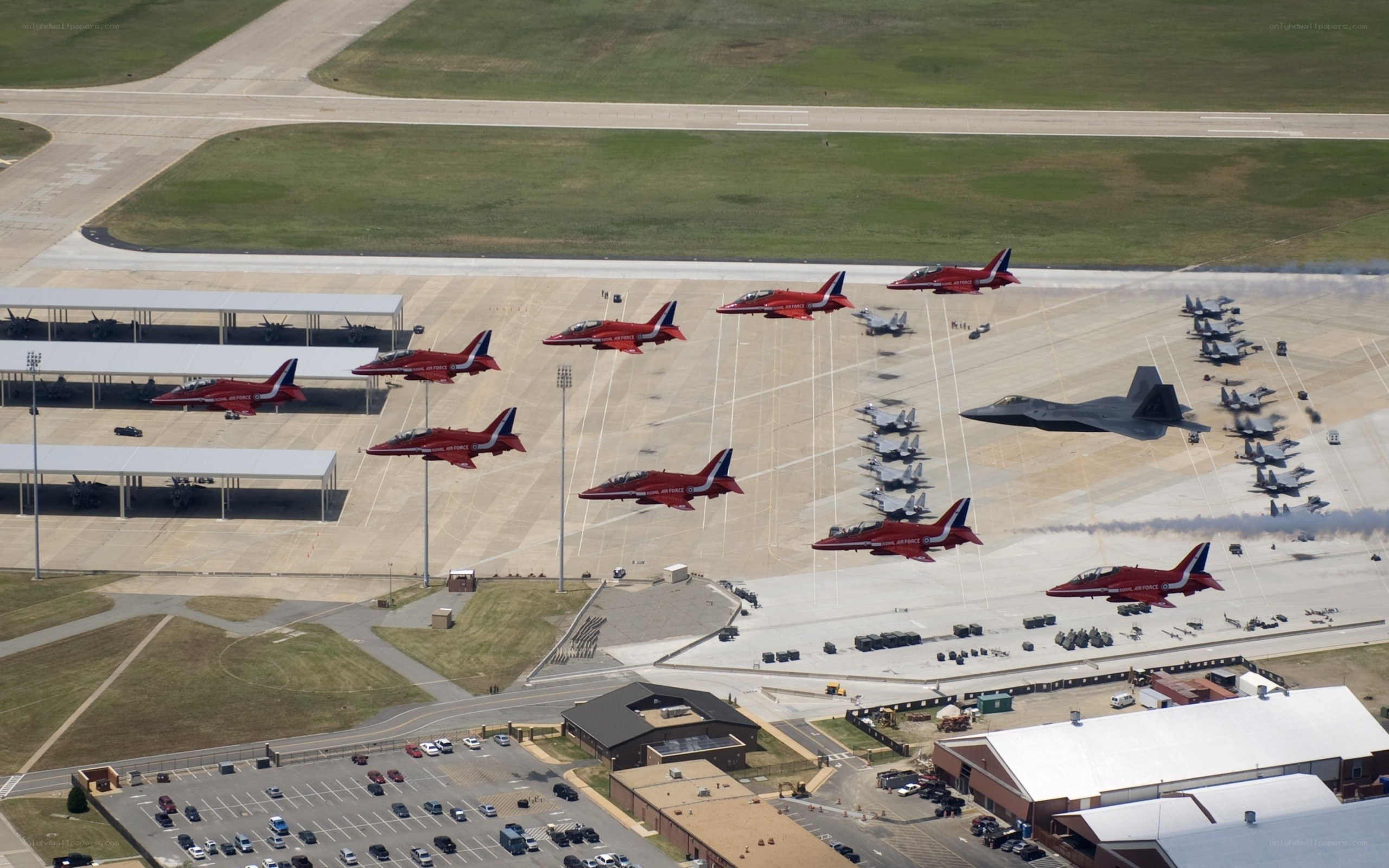 Red Arrows fly over airbase