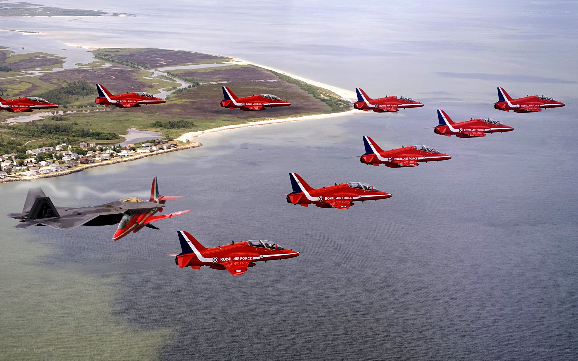 Red Arrows fly over coastline