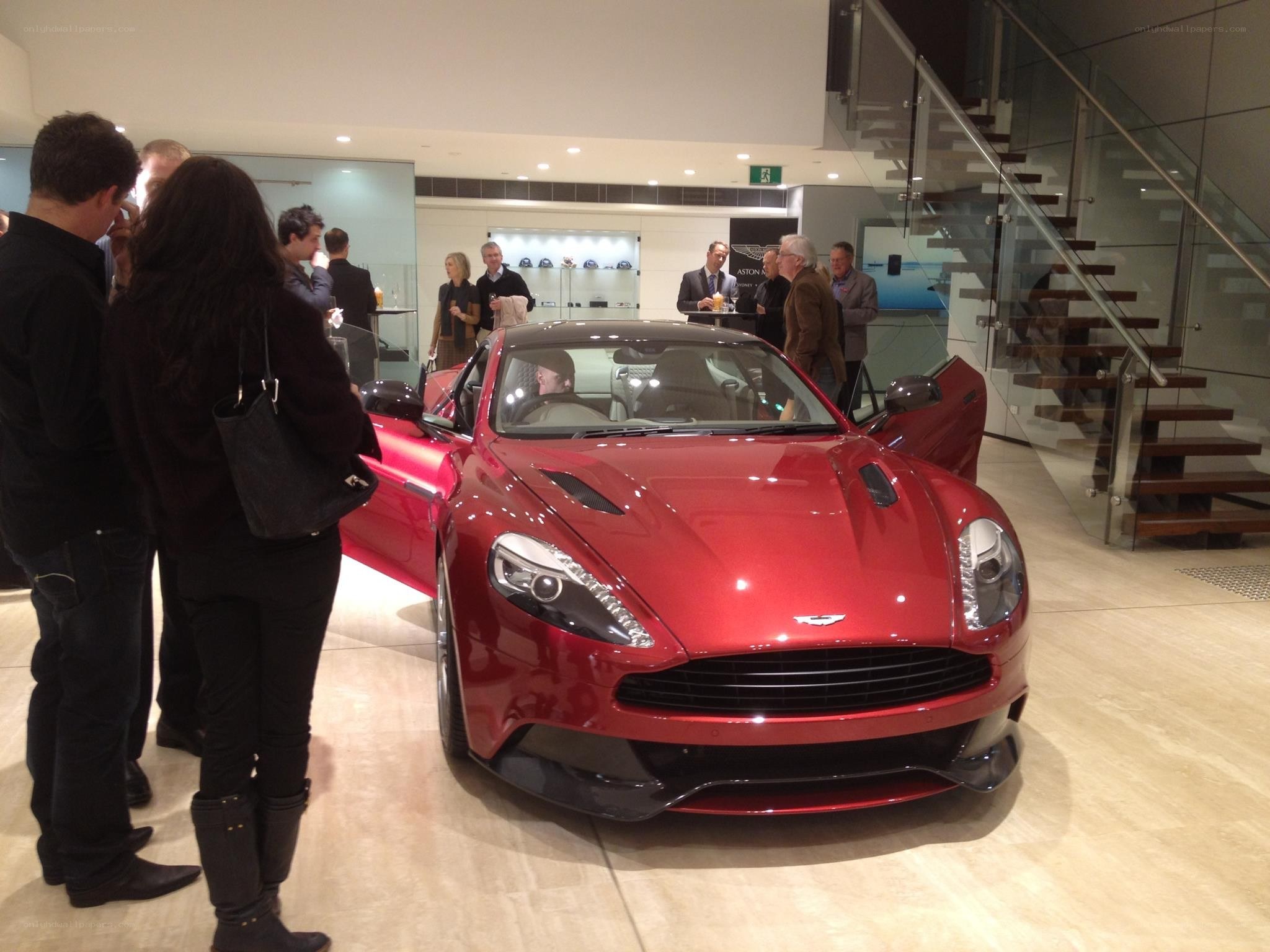 Red Aston Martin at showroom event