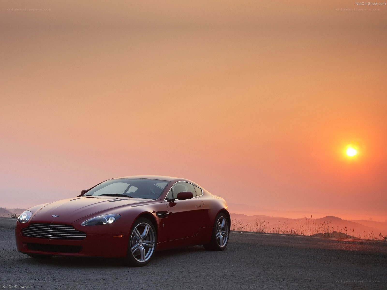Red Aston Martin at sunset