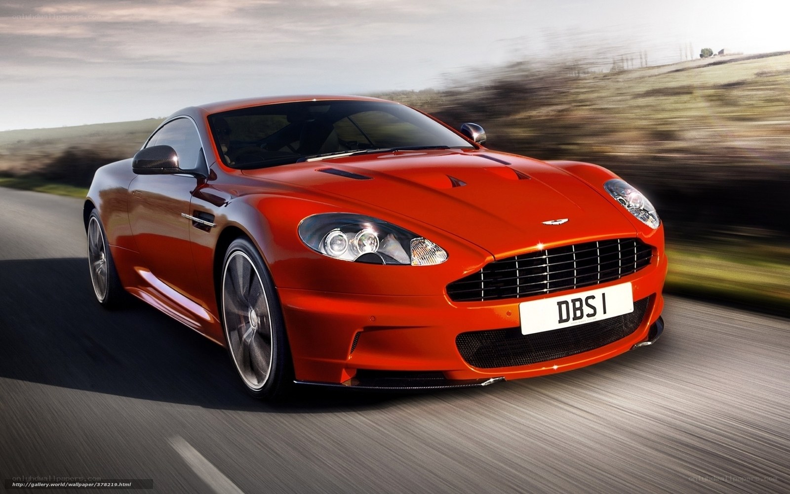 Red Aston Martin DBS in motion