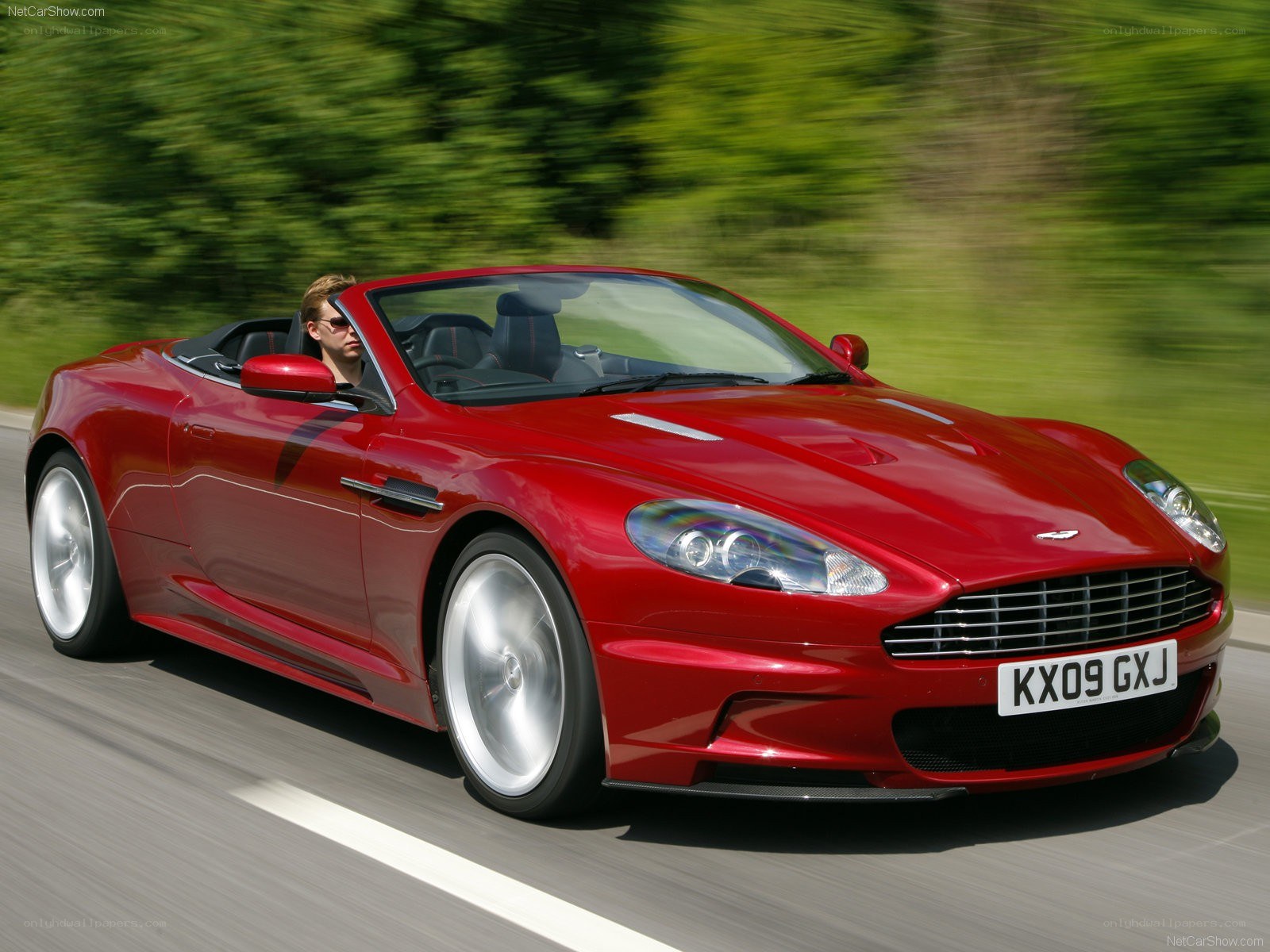 Red Aston Martin DBS in motion