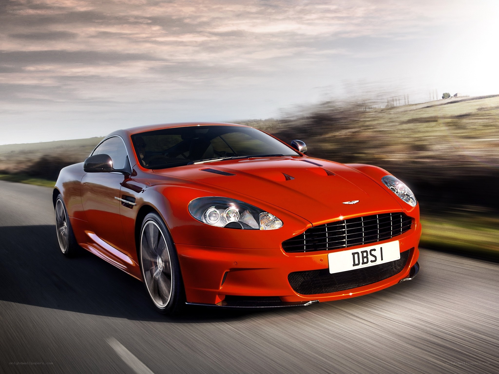 Red Aston Martin DBS in motion
