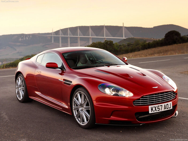 Red Aston Martin DBS on road