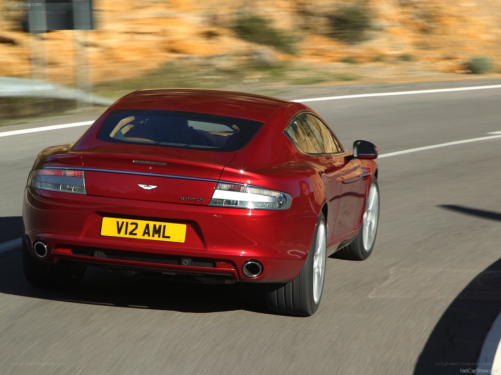 red aston martin driving