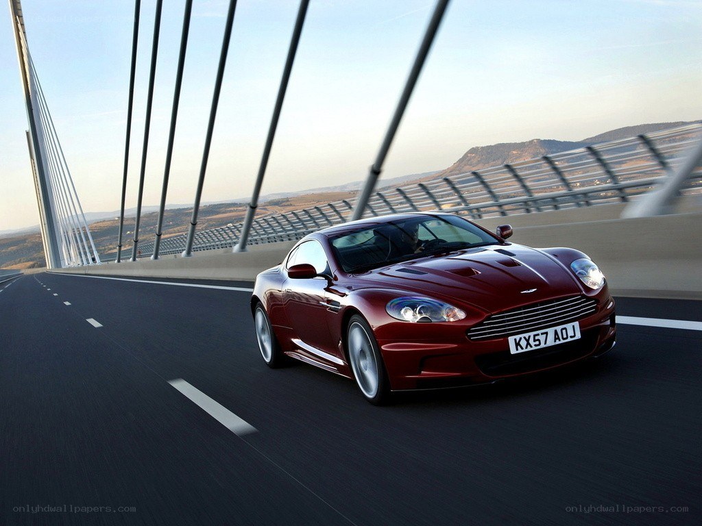 Red Aston Martin on a bridge