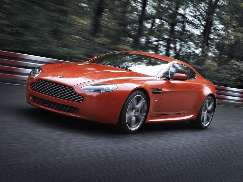 Red Aston Martin on a racetrack