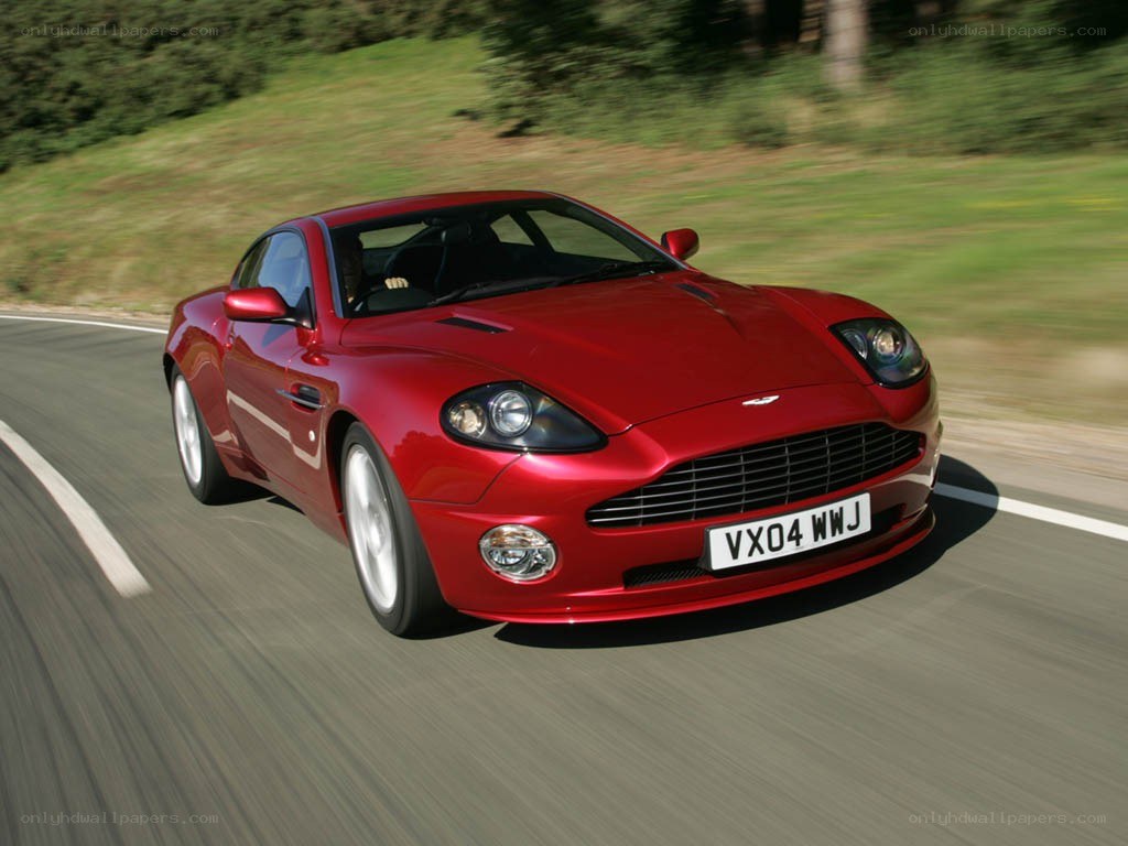 Red Aston Martin on a road