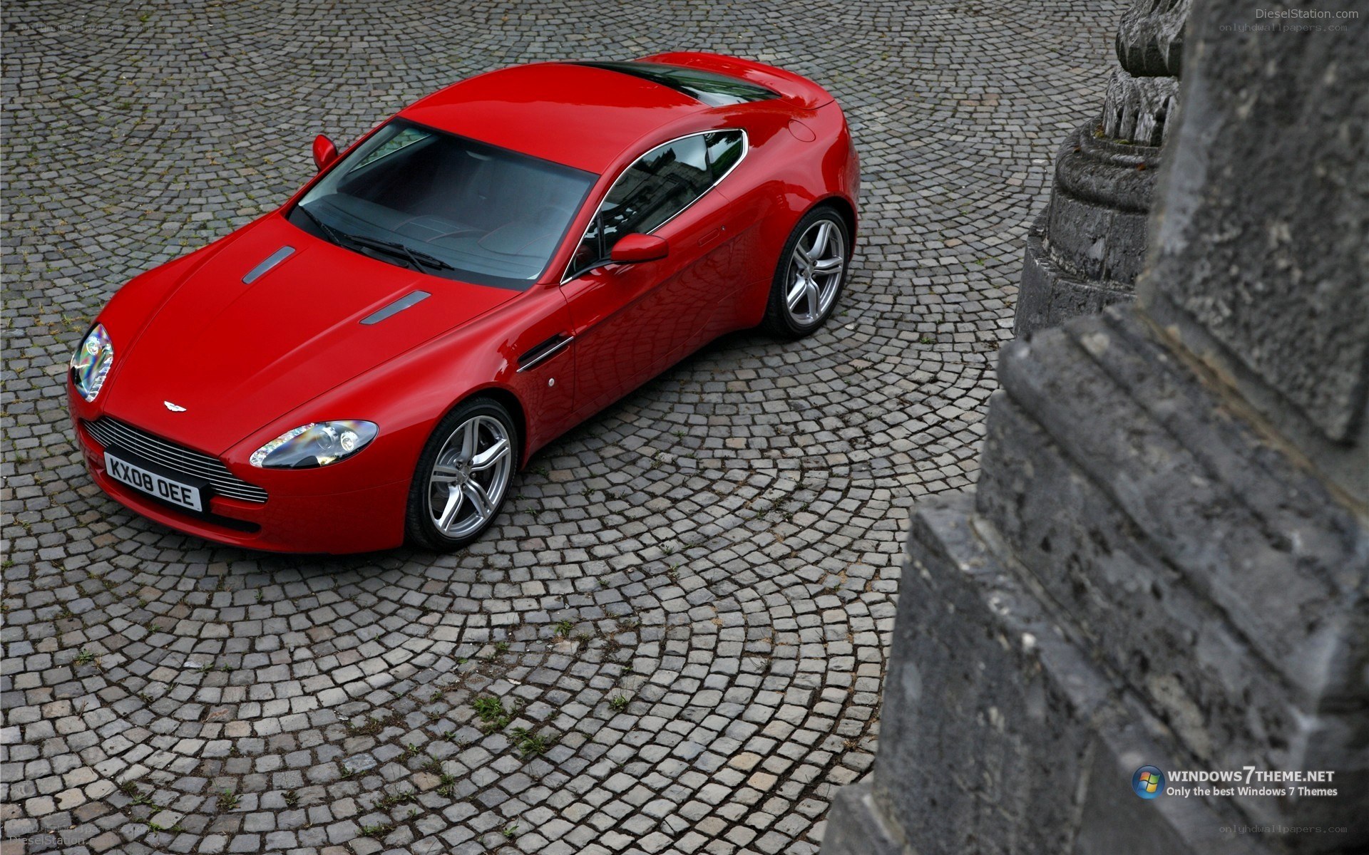 red aston martin on cobblestones