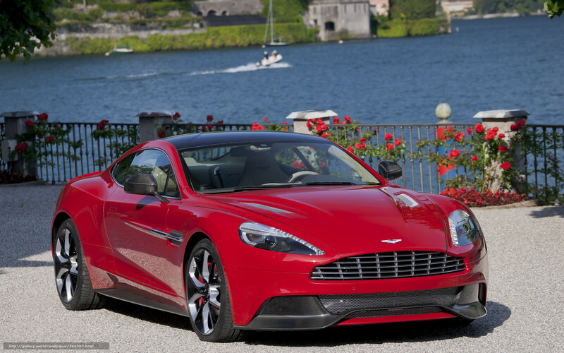 Red Aston Martin on lakeside