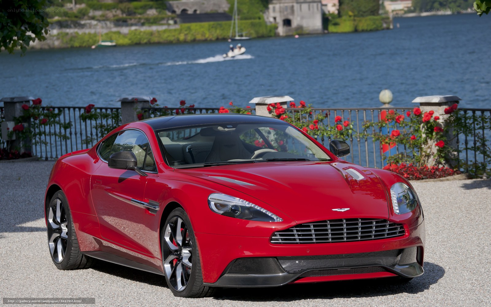 Red Aston Martin on lakeside