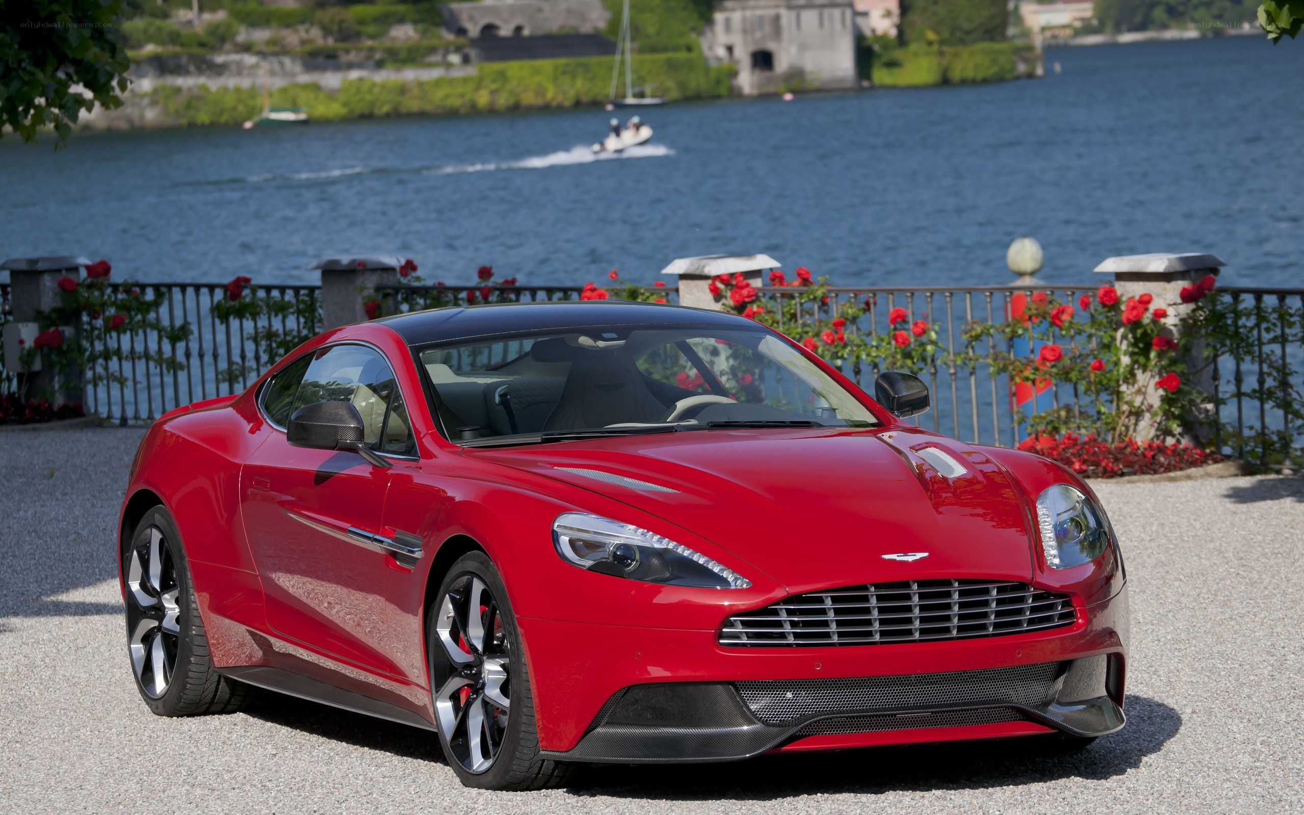 Red Aston Martin on lakeside