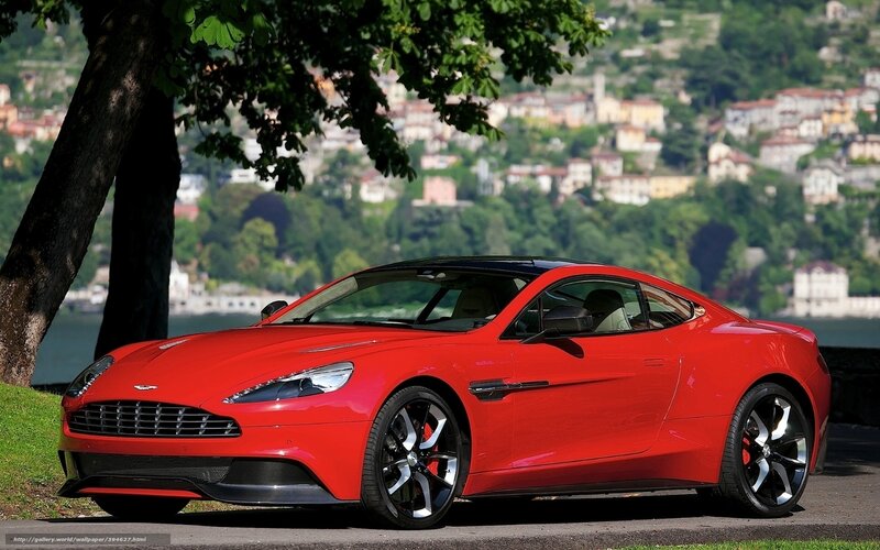 Red Aston Martin on lakeside