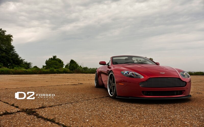 Red Aston Martin on pavement