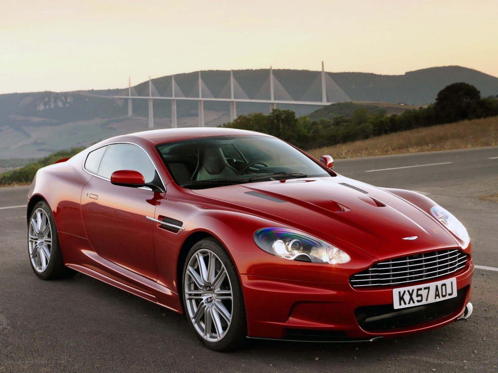 Red Aston Martin on road