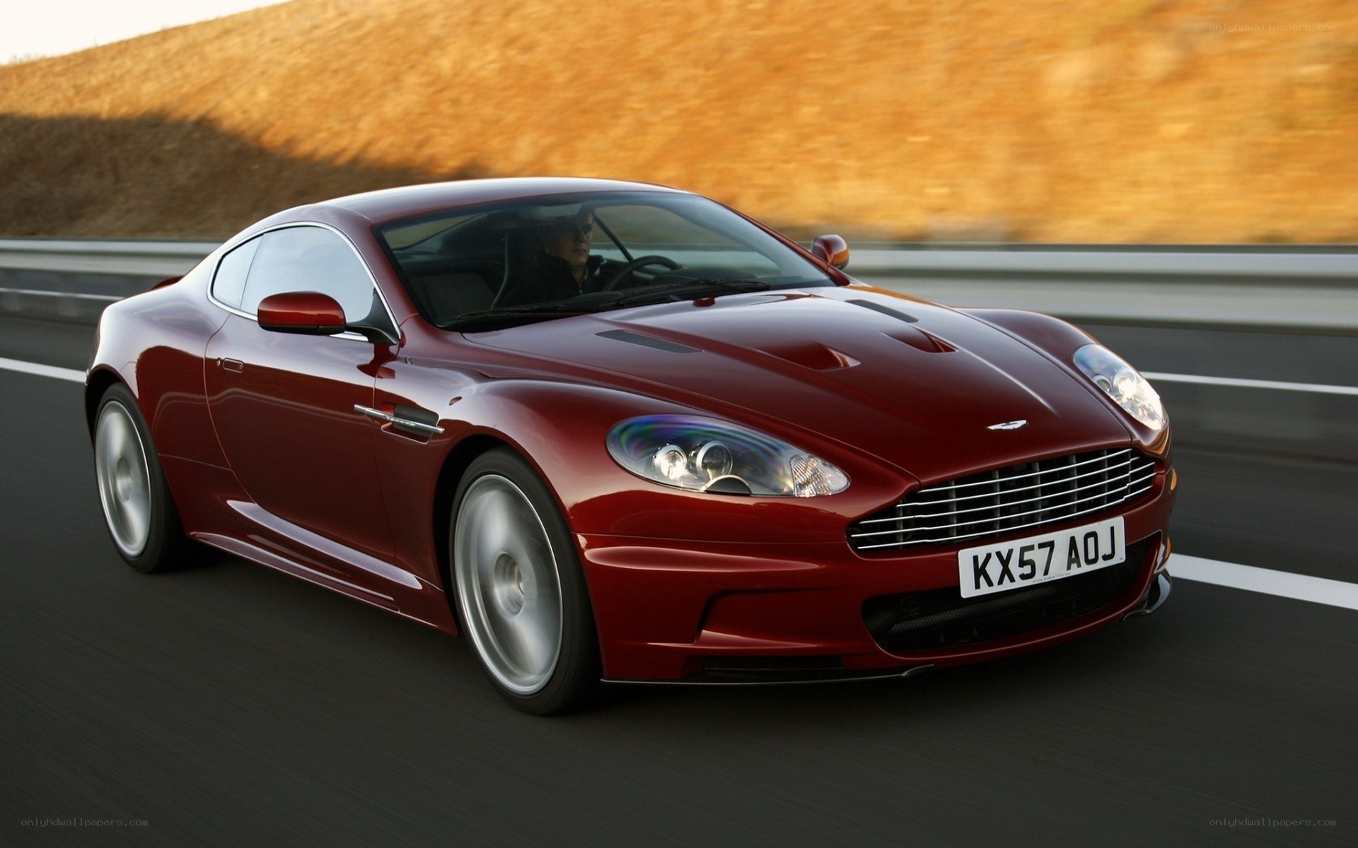 red aston martin on road