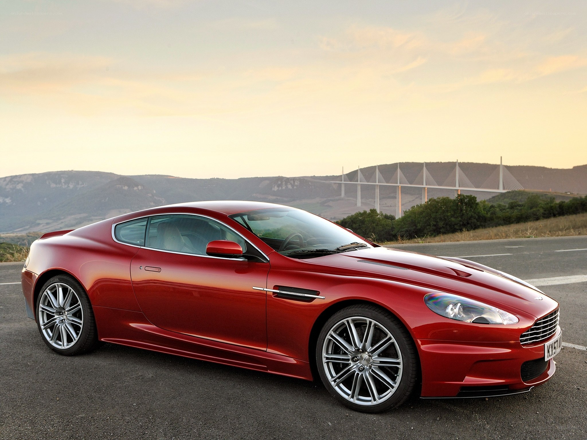 Red Aston Martin on road