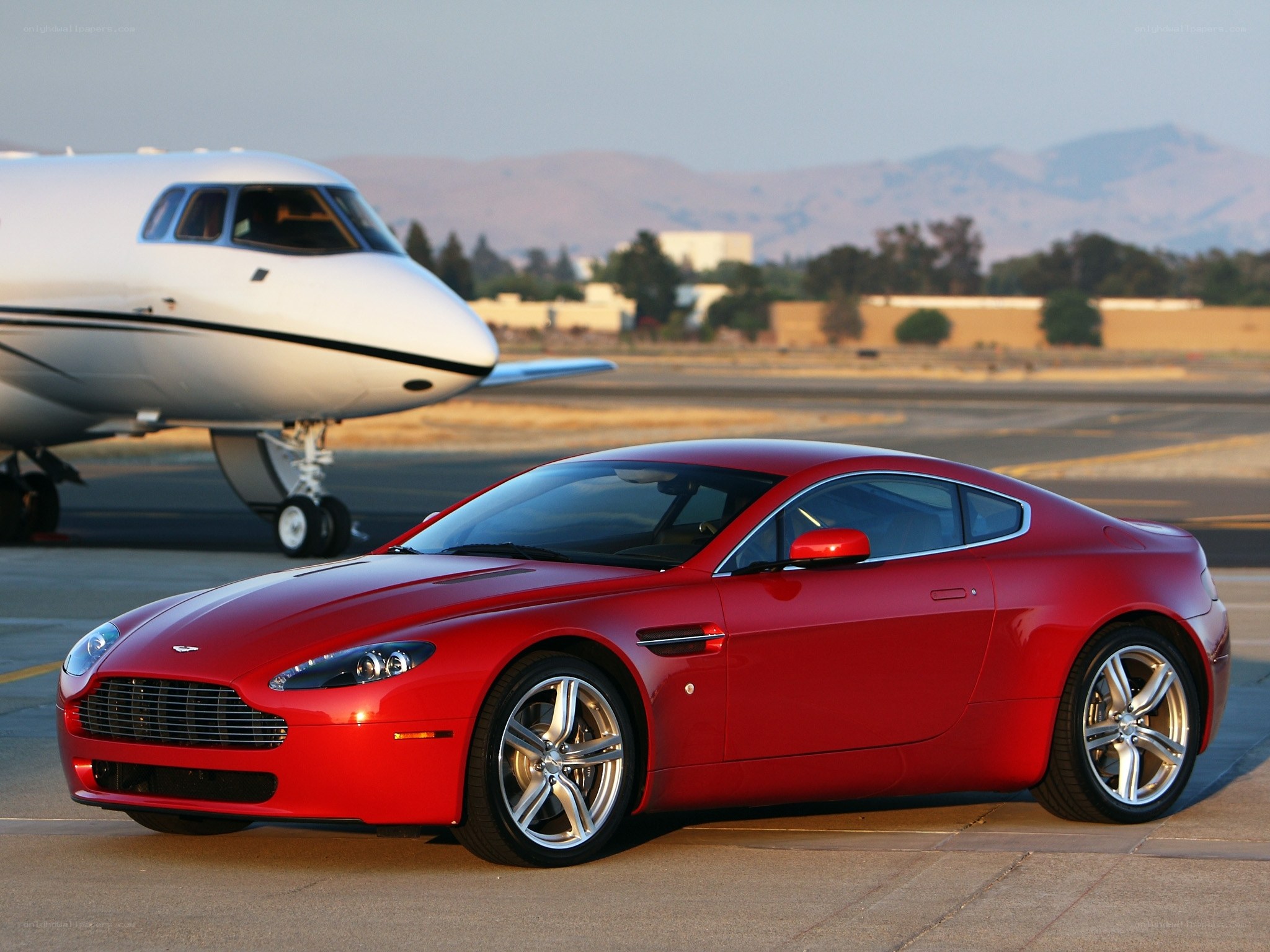 Red Aston Martin on tarmac