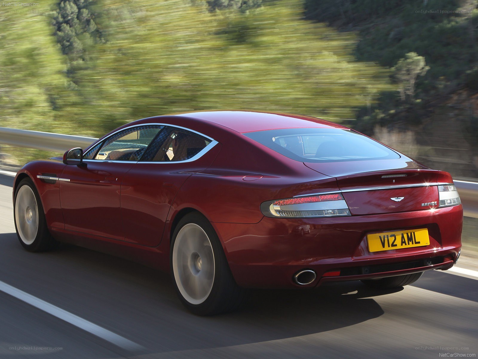 Red Aston Martin Rapide in motion