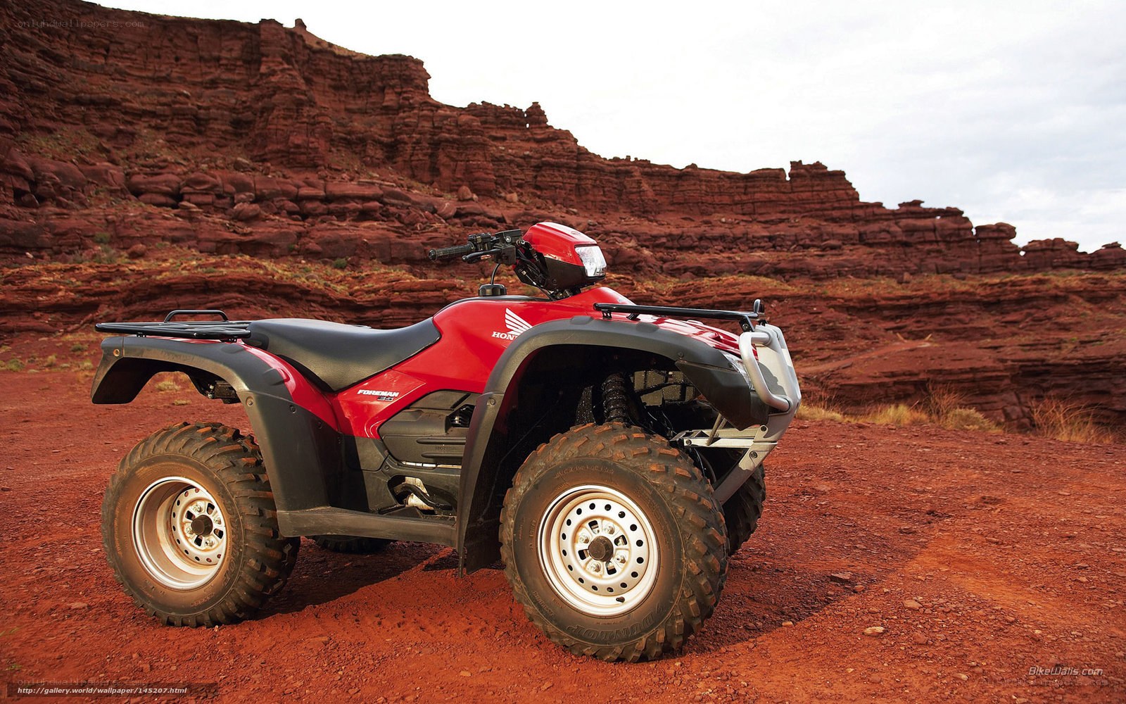 Red ATV in desert canyon
