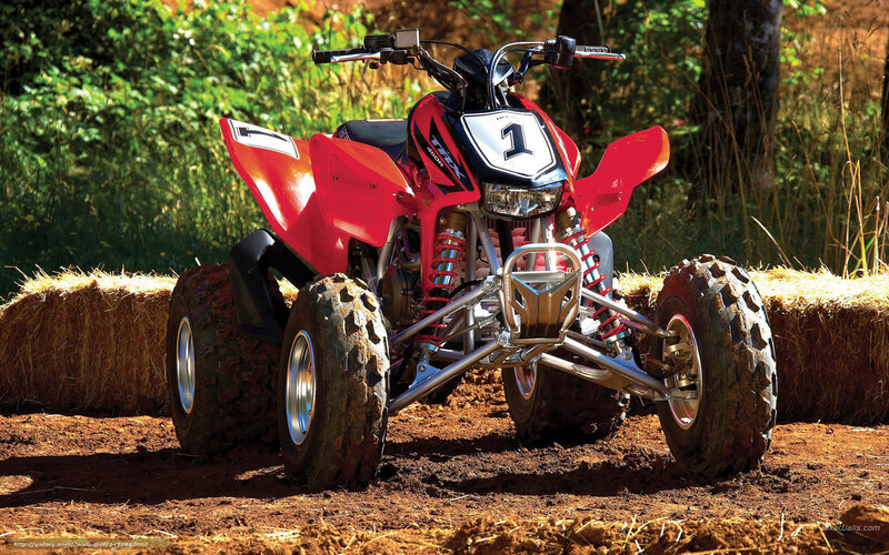 Red ATV on dirt path