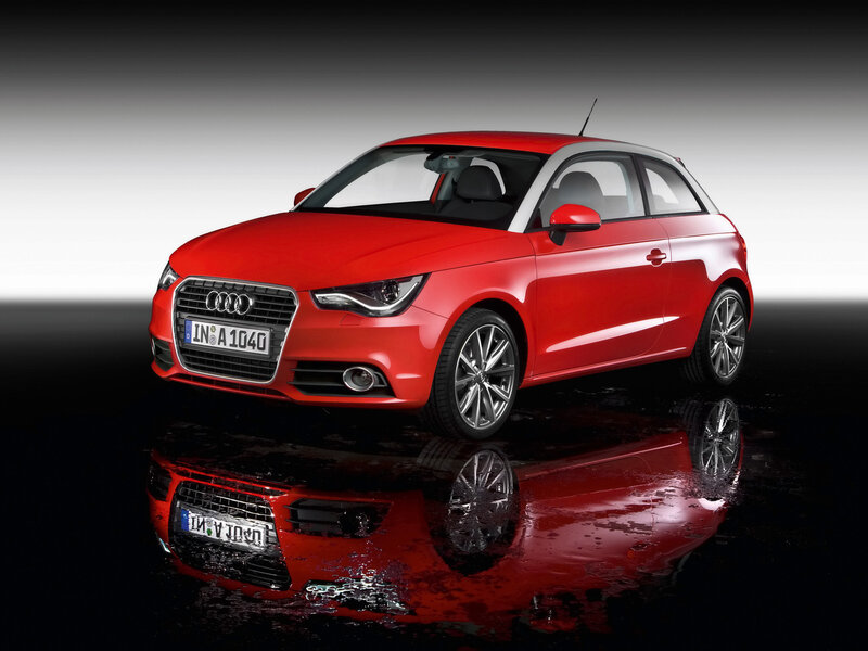 Red Audi A1 on reflective surface