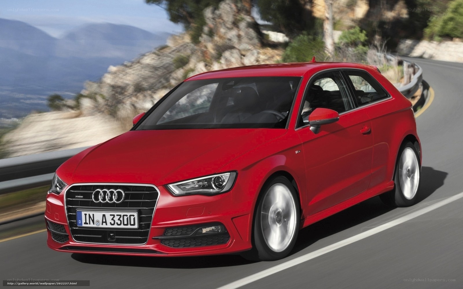 Red Audi A3 on winding road
