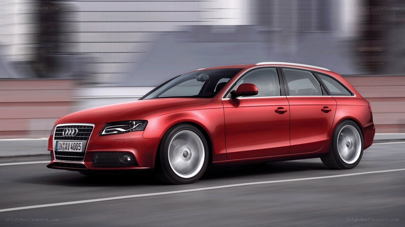 Red Audi A4 Avant in motion