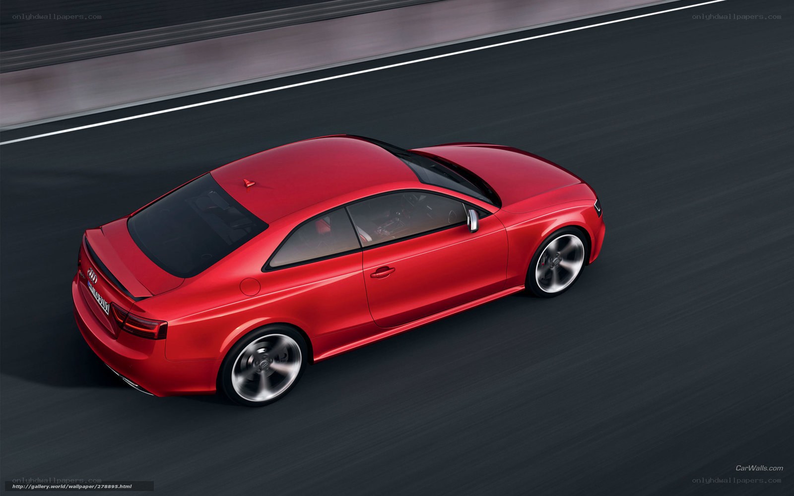 Red Audi coupe on track