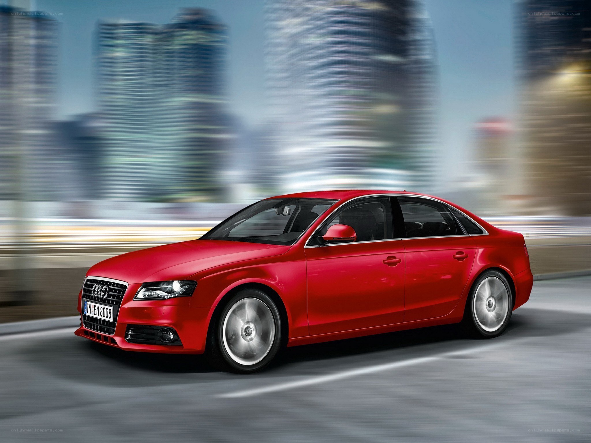 Red Audi driving in city