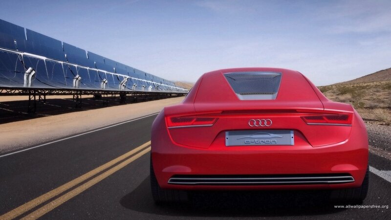 Red Audi e-tron on desert road