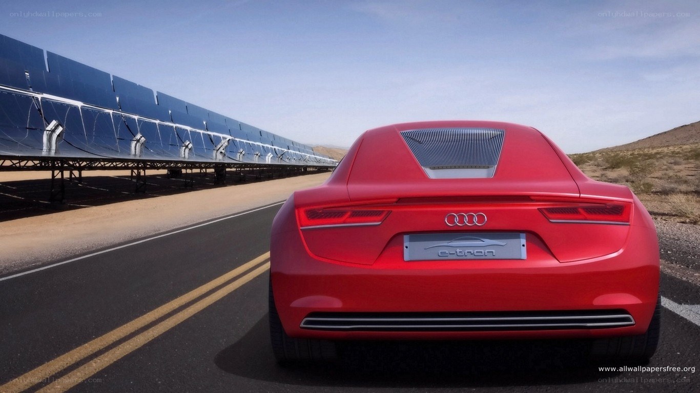 Red Audi e-tron on desert road