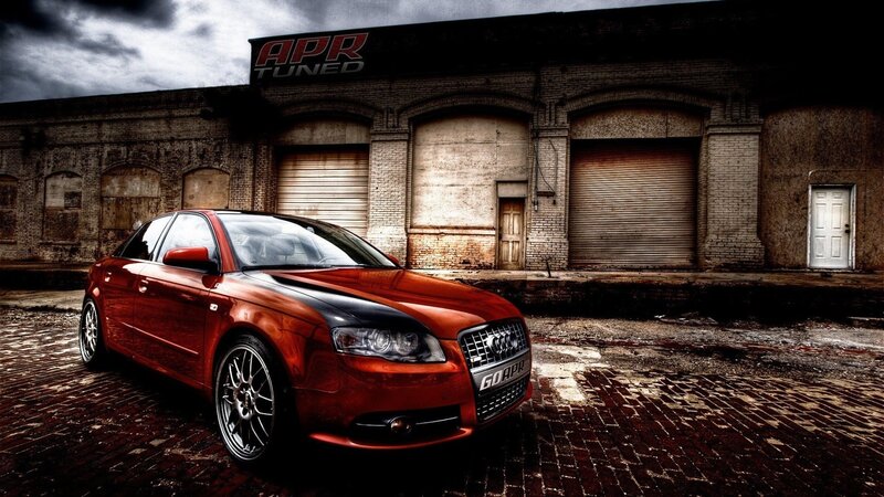 red audi in front of apr tuned building